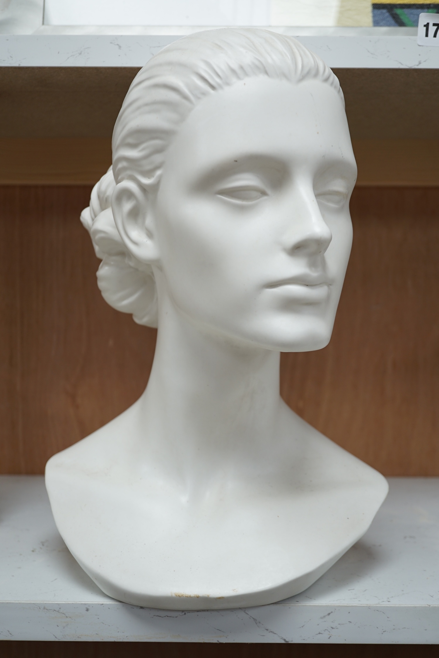 A Mouska white ceramic bust of a young woman, 33cm high. Condition - various chips to glazing on base